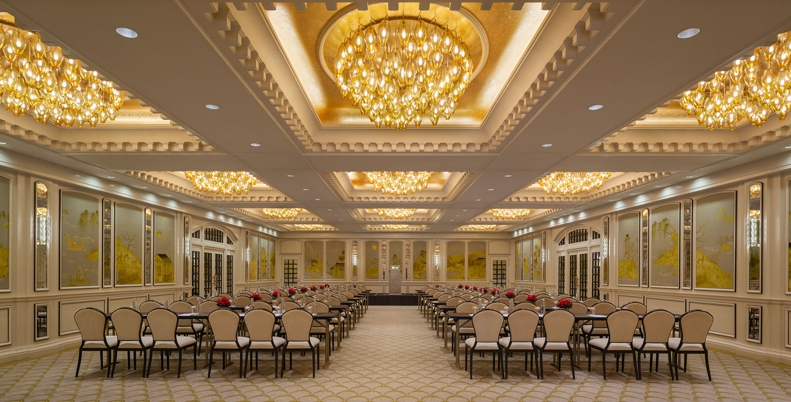 a room with many chairs and a chandelier