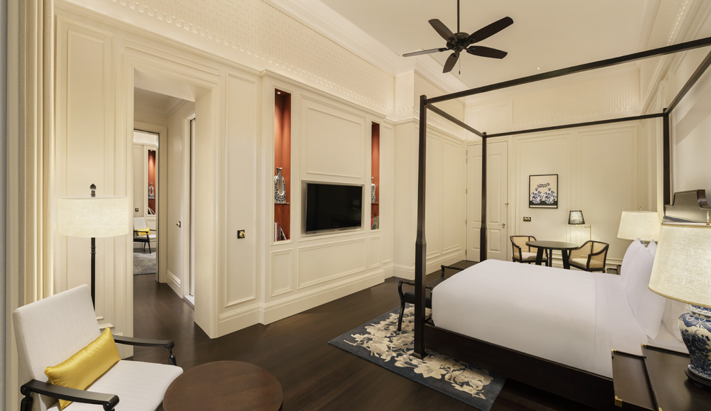 a room with a bed and a tv
