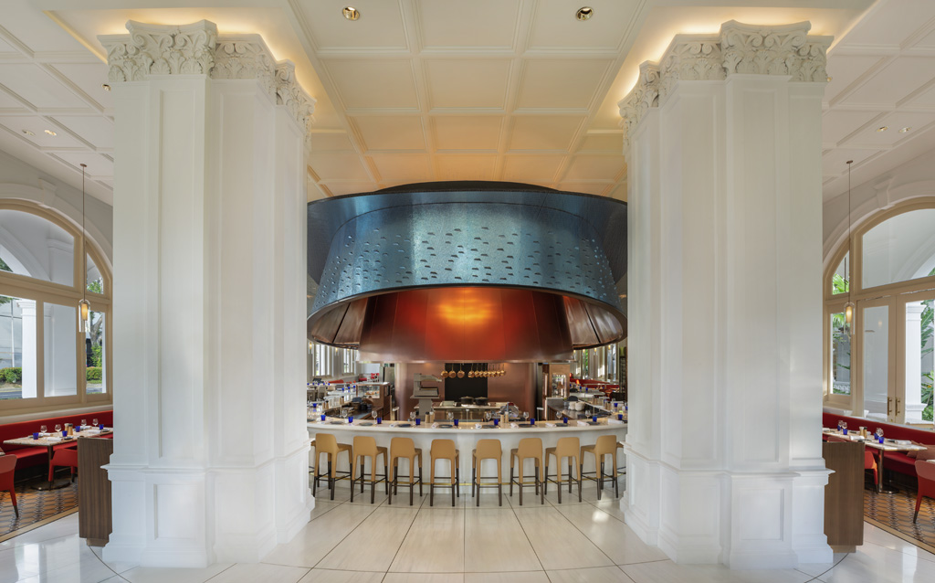 a restaurant with a large round hood