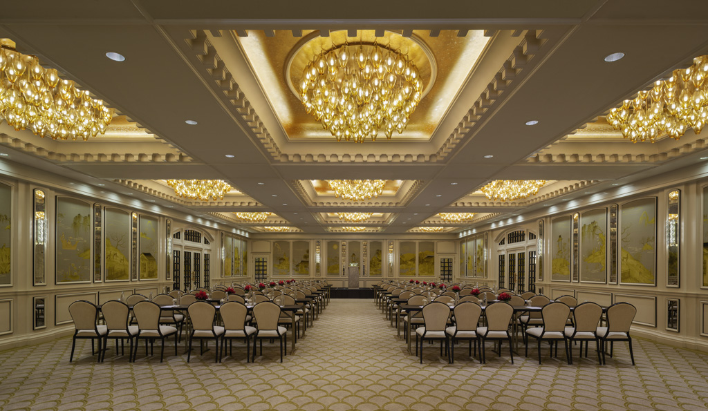 a room with many chairs and a chandelier