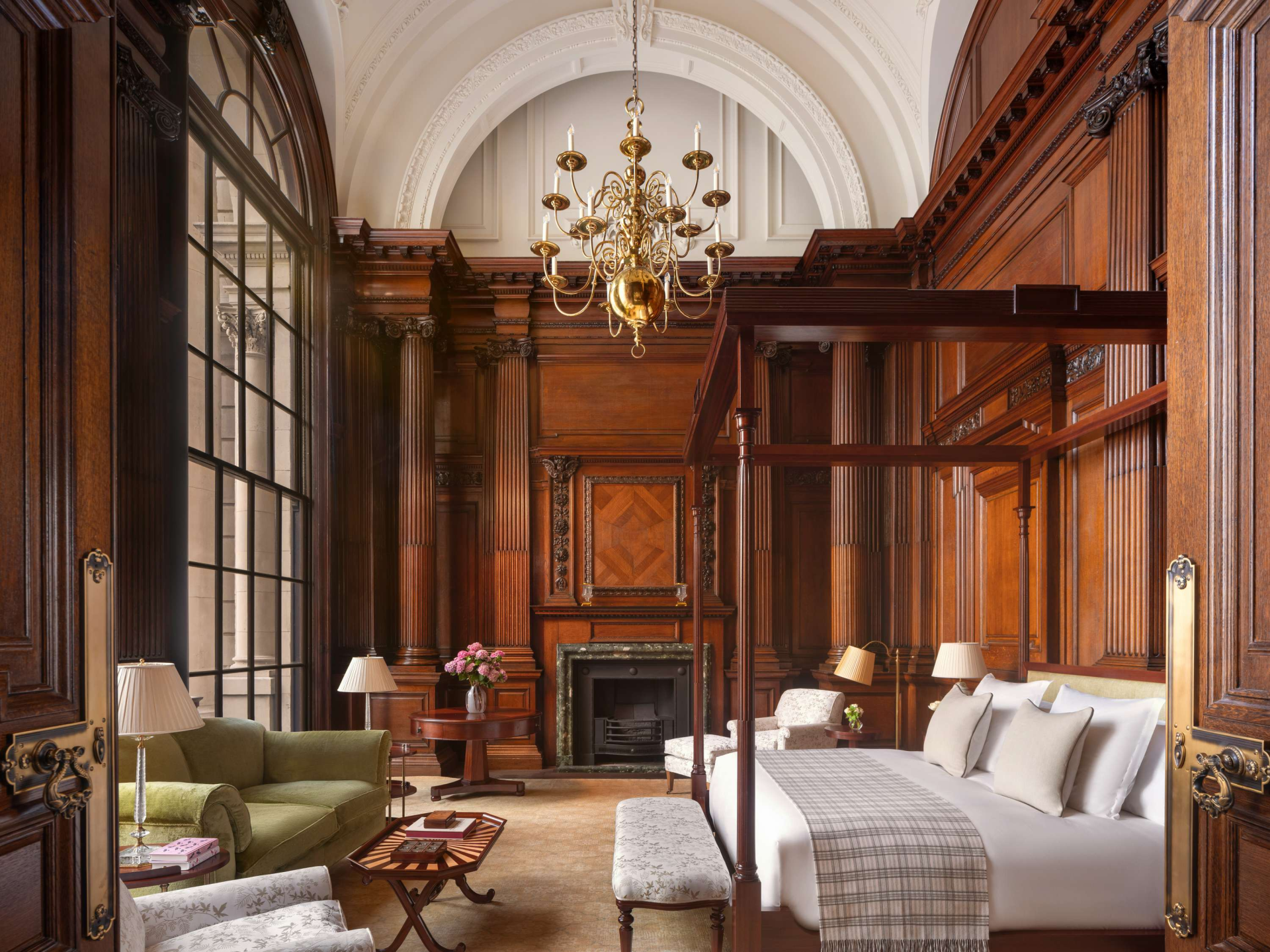 a room with a bed and a fireplace