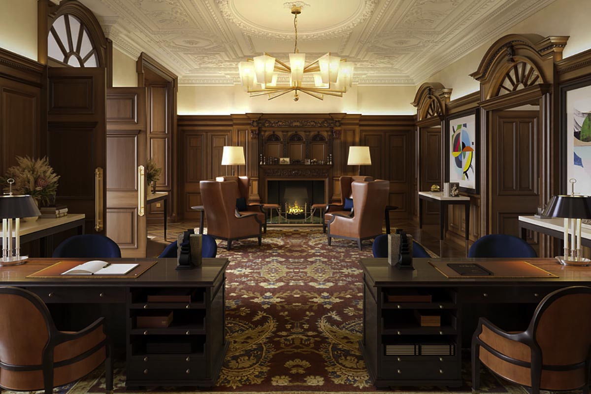 a room with a fireplace and chairs
