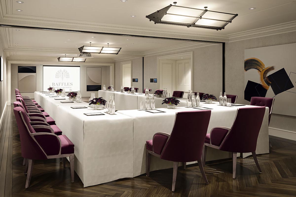 a room with long tables and chairs