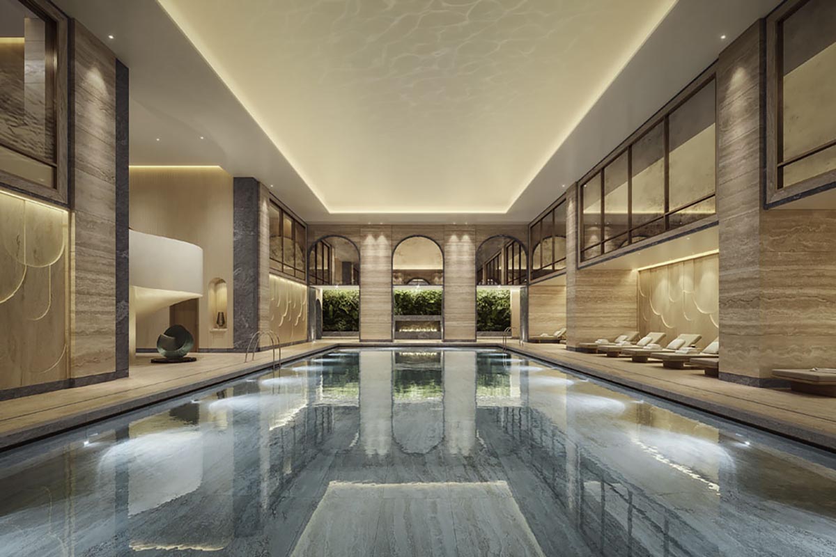 a indoor pool with a large deck and chairs