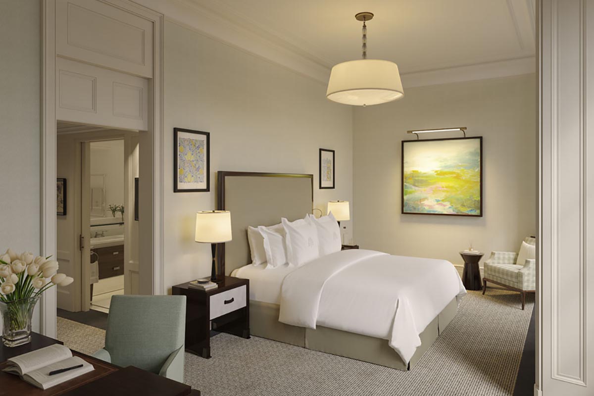a bedroom with a bed and a lamp
