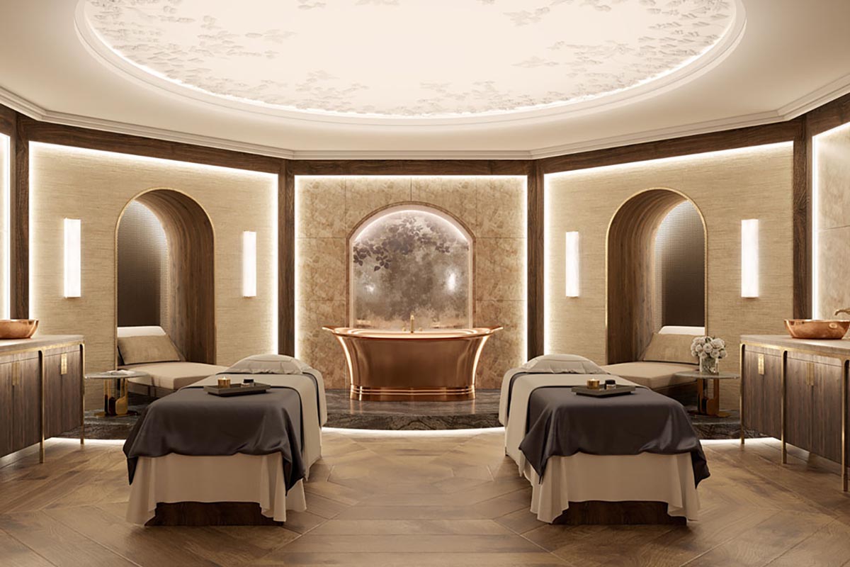 a room with beds and a gold tub