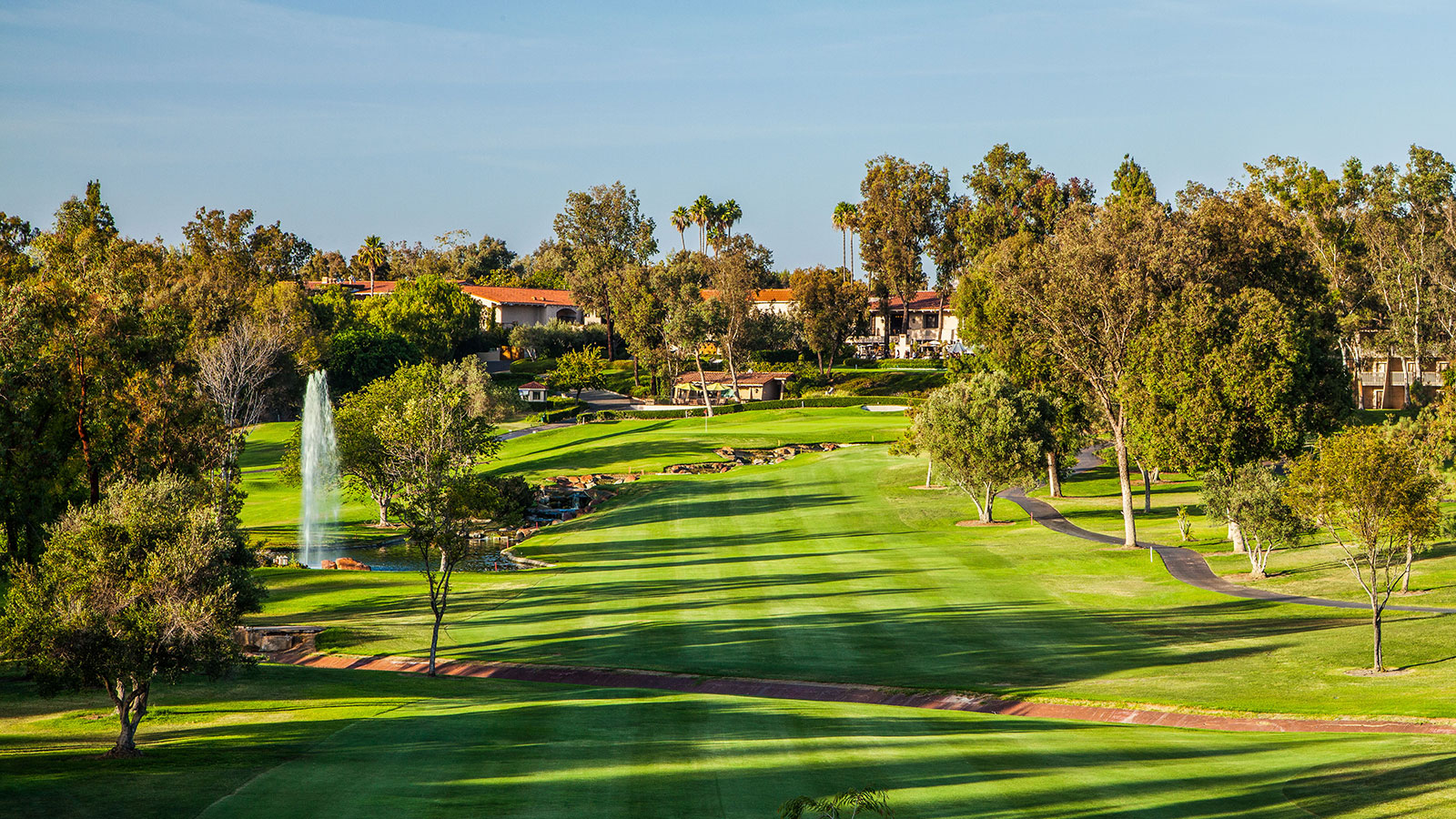 a golf course with a fountain