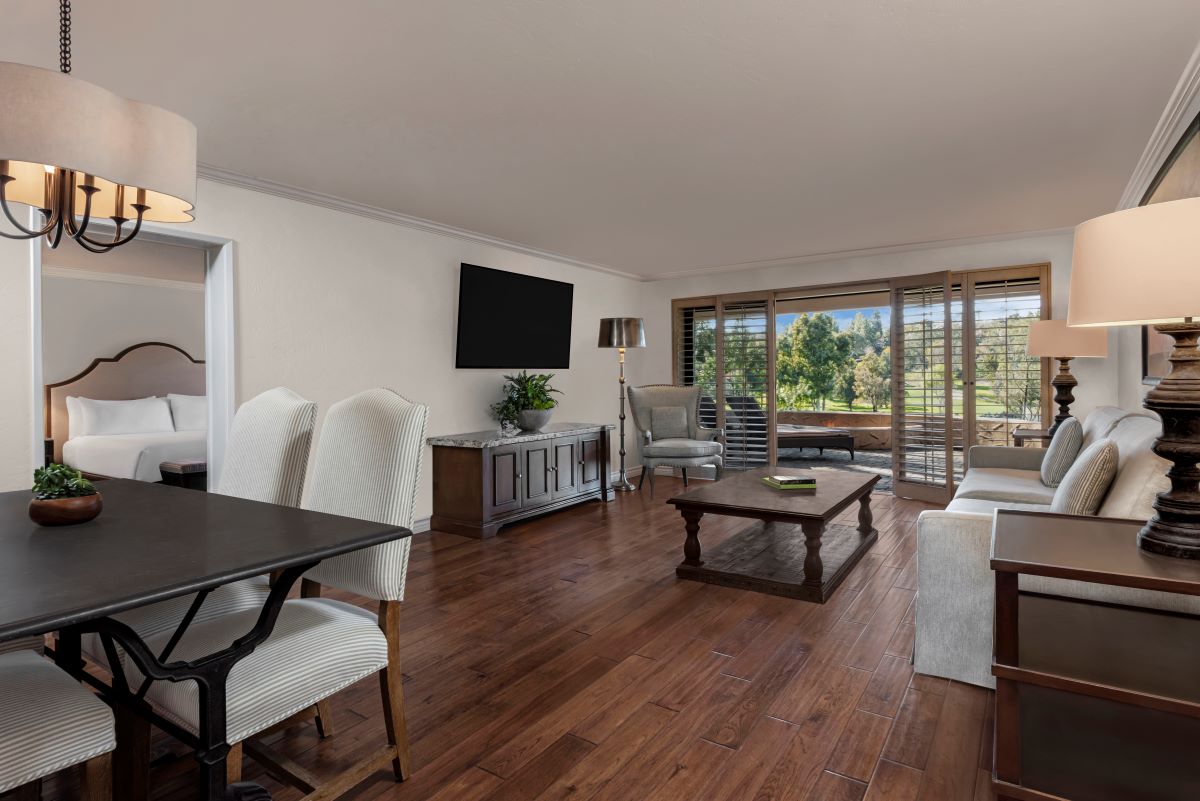a living room with a television and a table