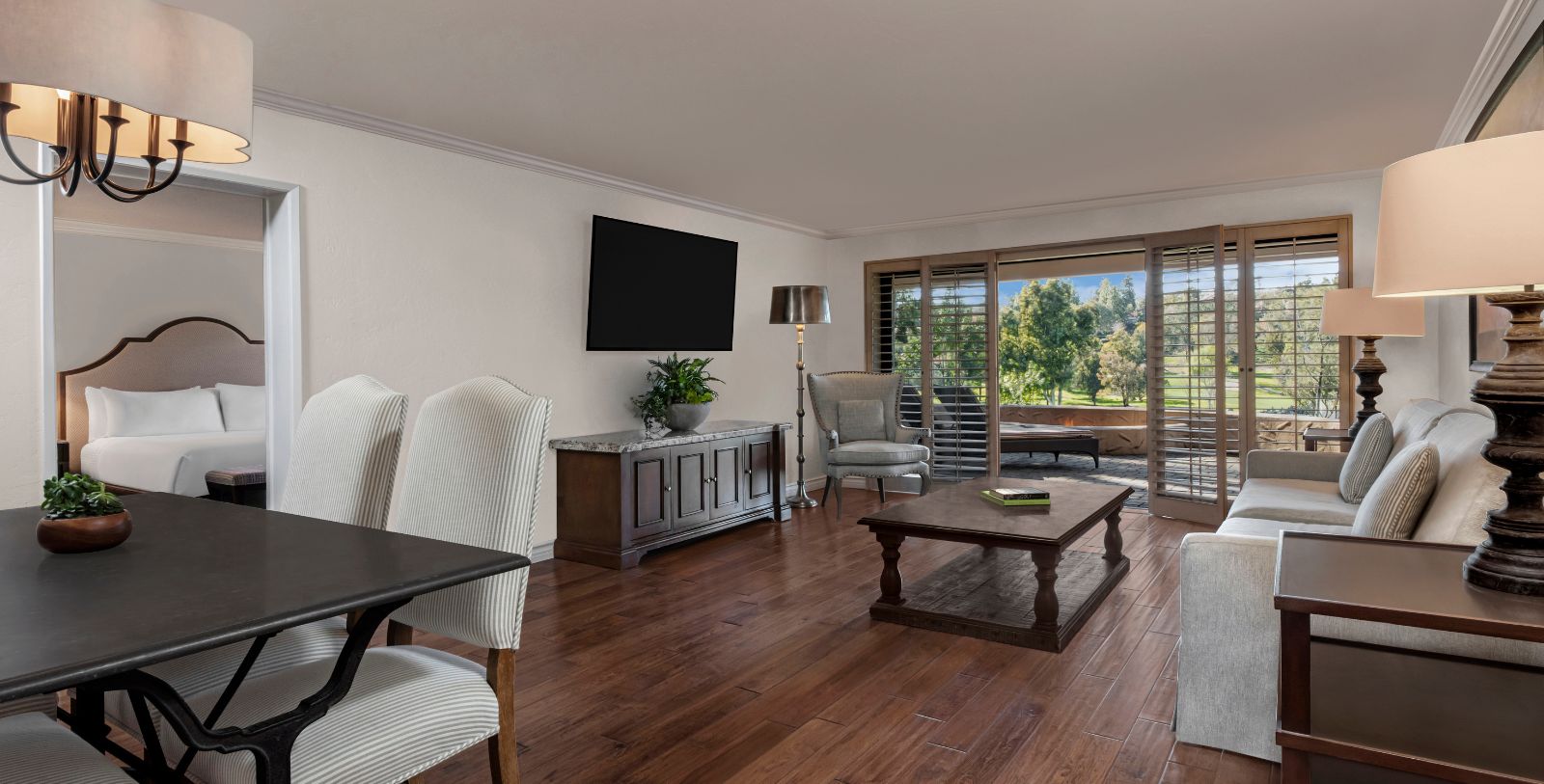 a living room with a television and a table