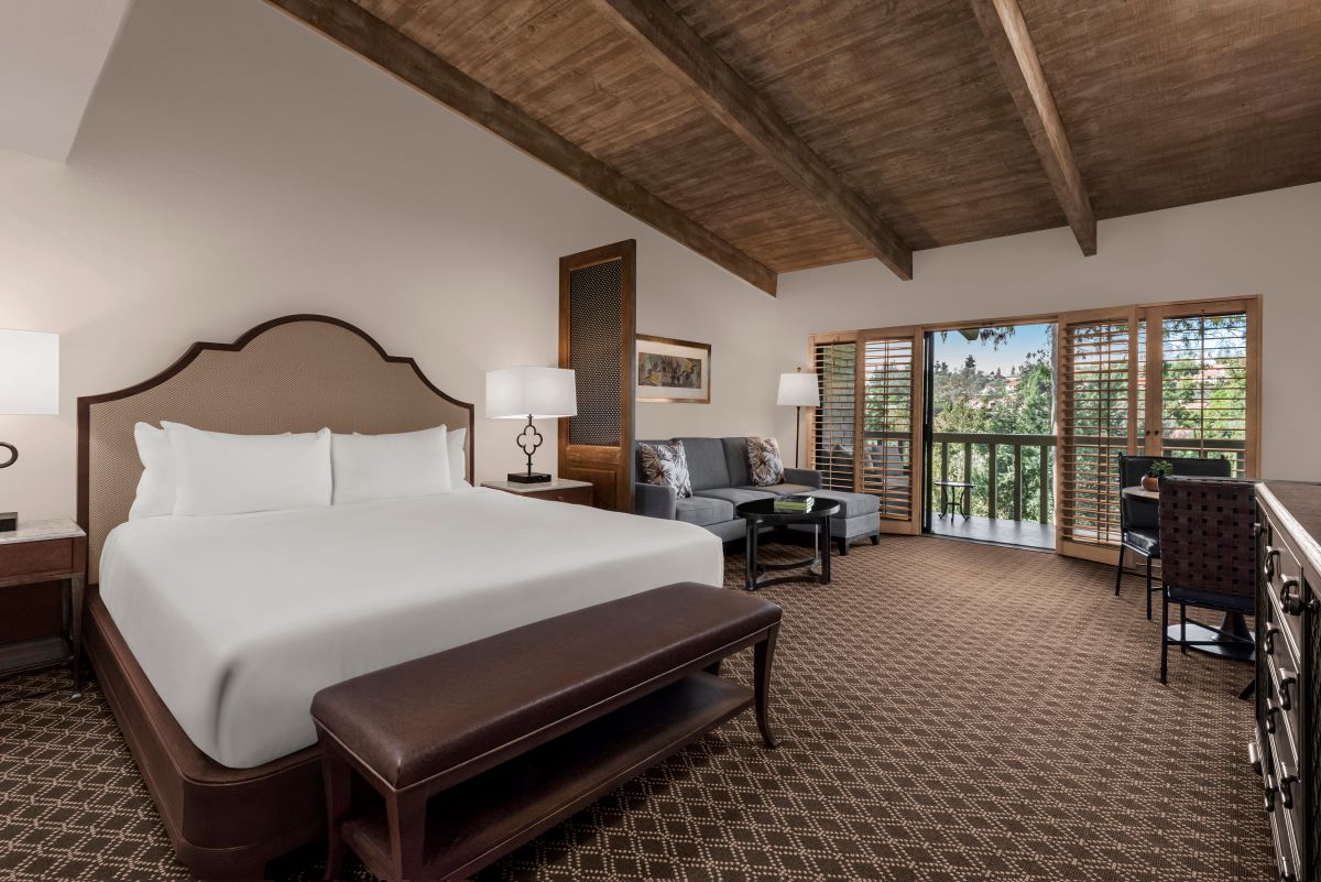 a bedroom with a bed and a couch