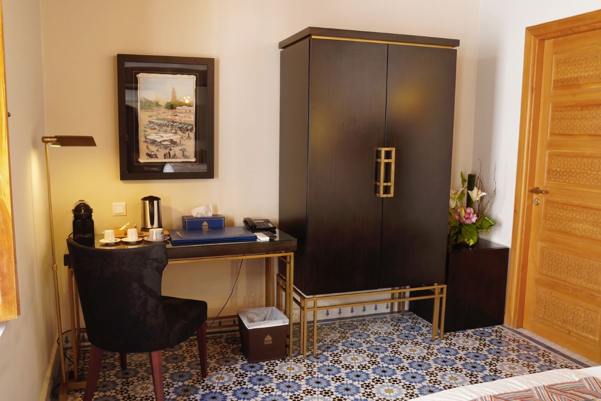 a room with a large cabinet and a chair