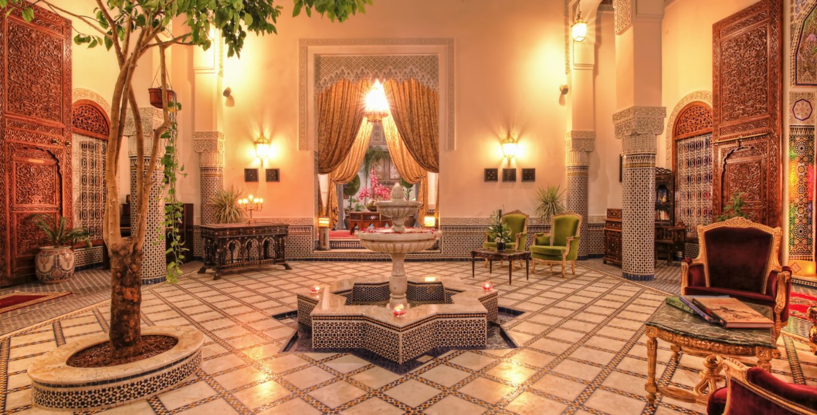 a room with a fountain and chairs