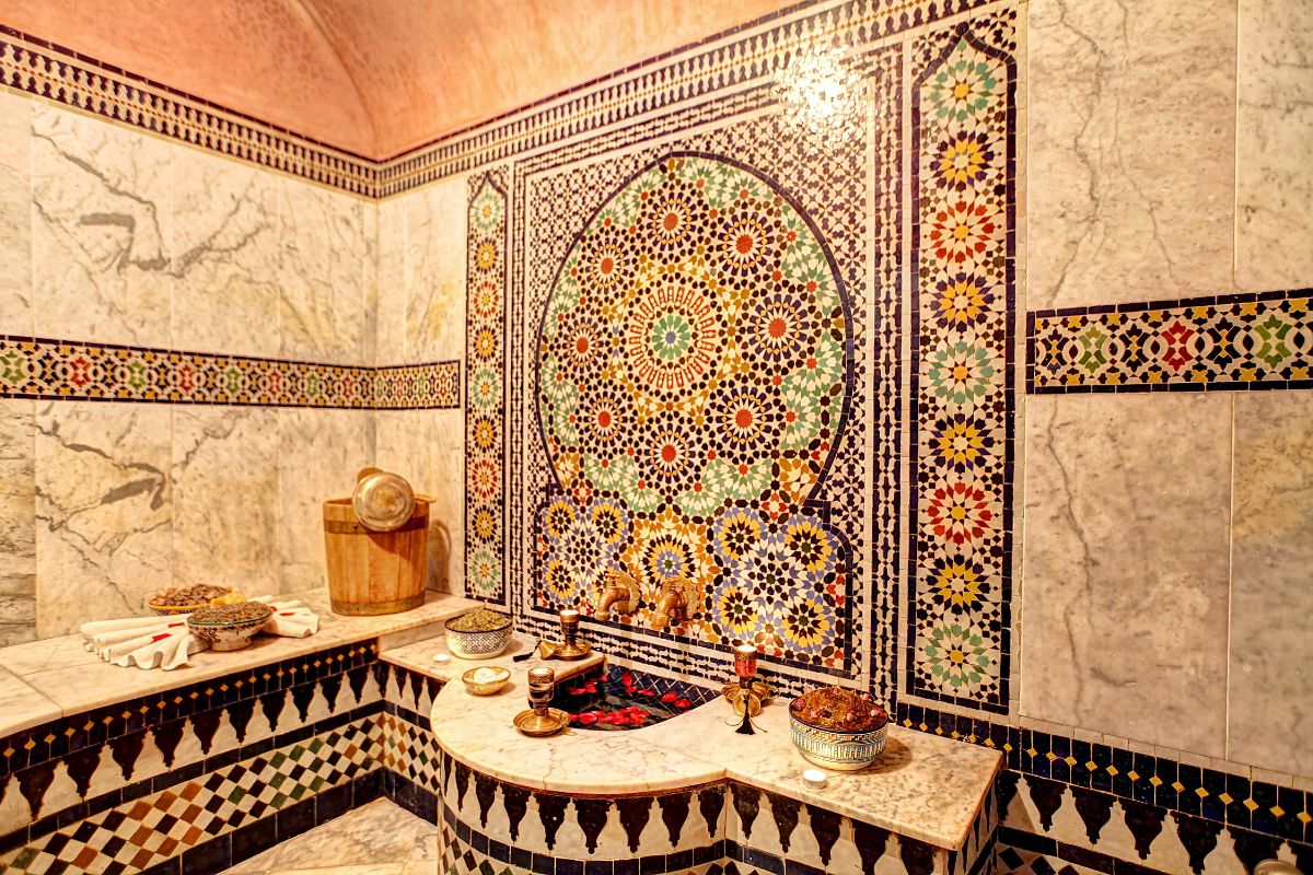 a bathroom with mosaic tiles