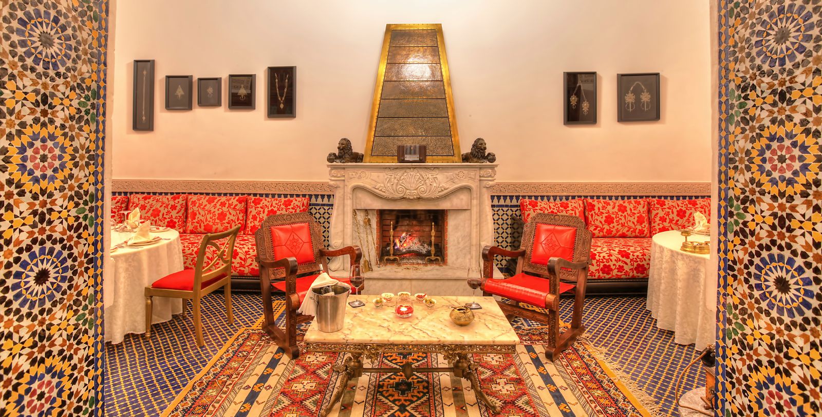a room with a fireplace and chairs
