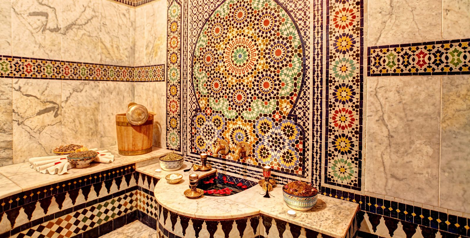 a bathroom with mosaic tiles