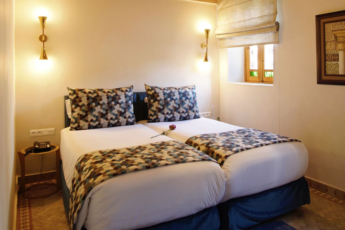 a bed with two pillows