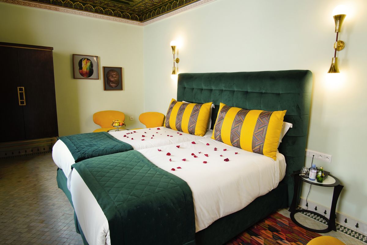 a bed with rose petals on it