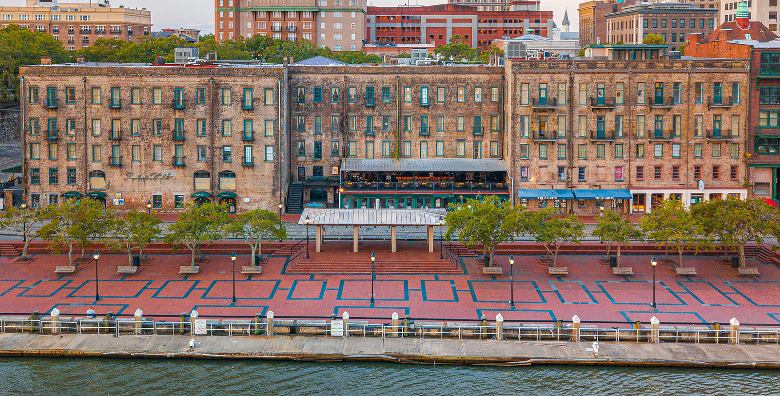 a building next to a body of water