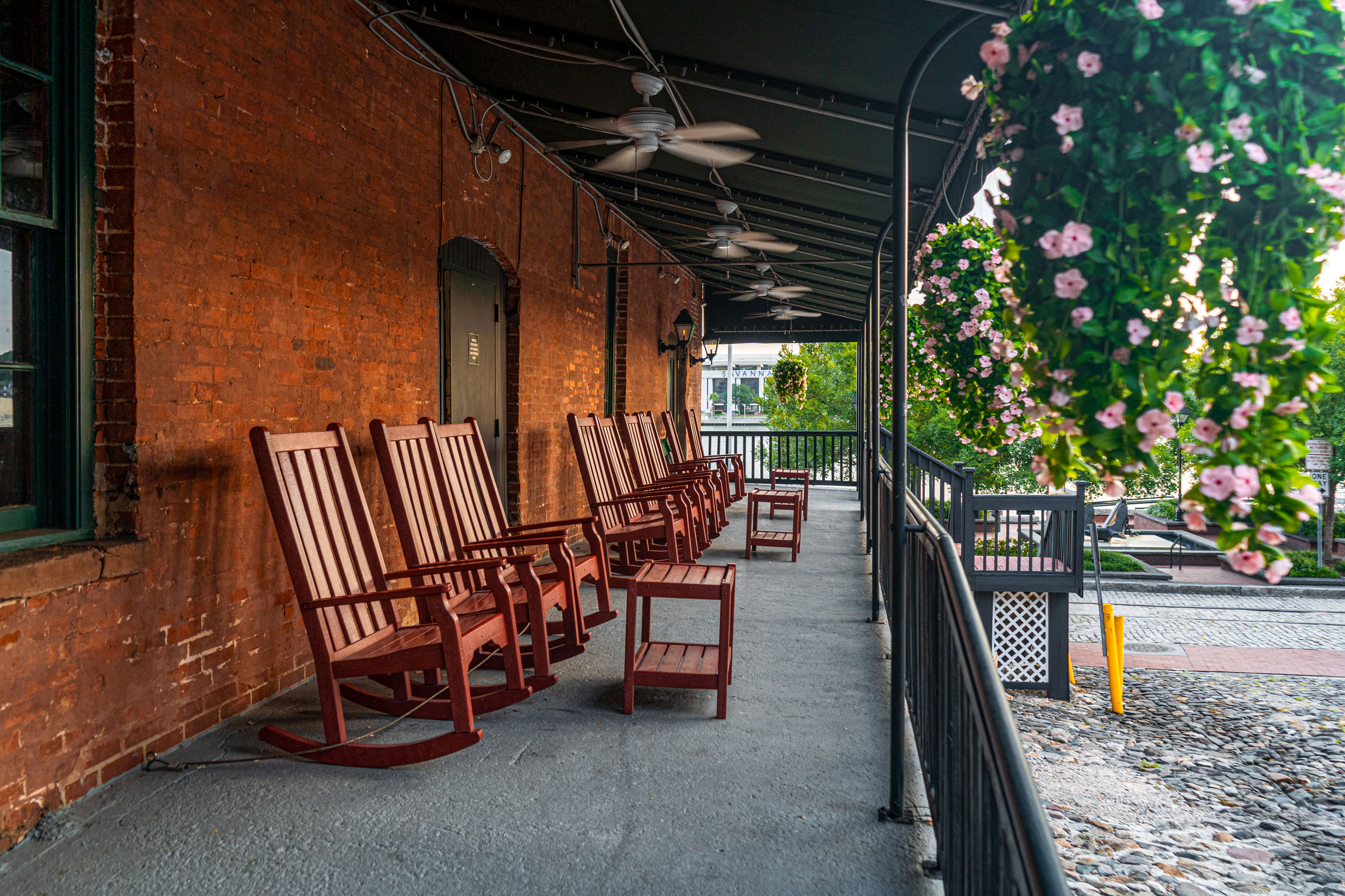 a row of chairs on a porch