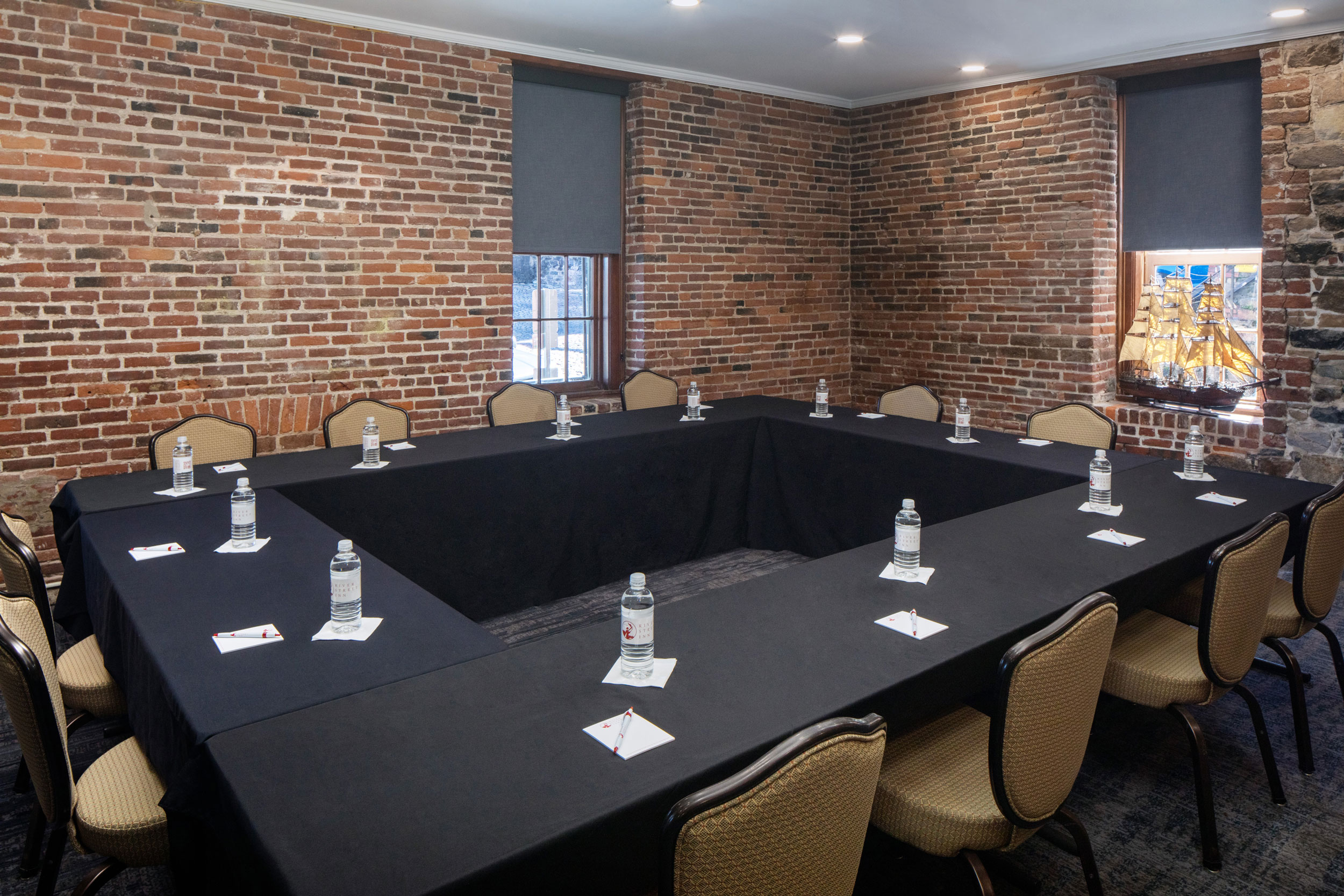 a conference room with a table and chairs