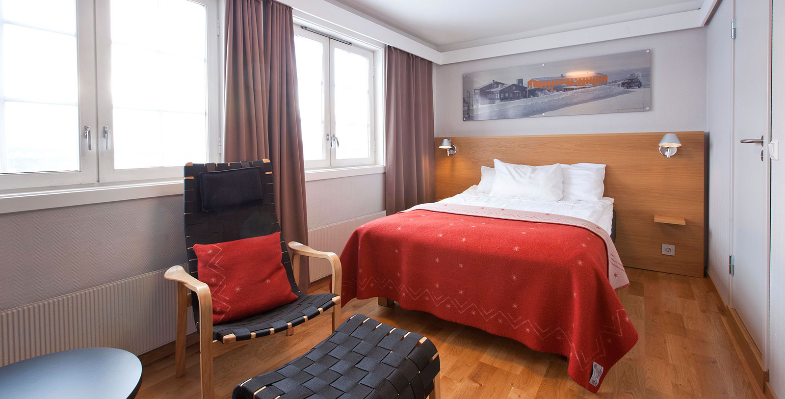 a bedroom with a bed and chair