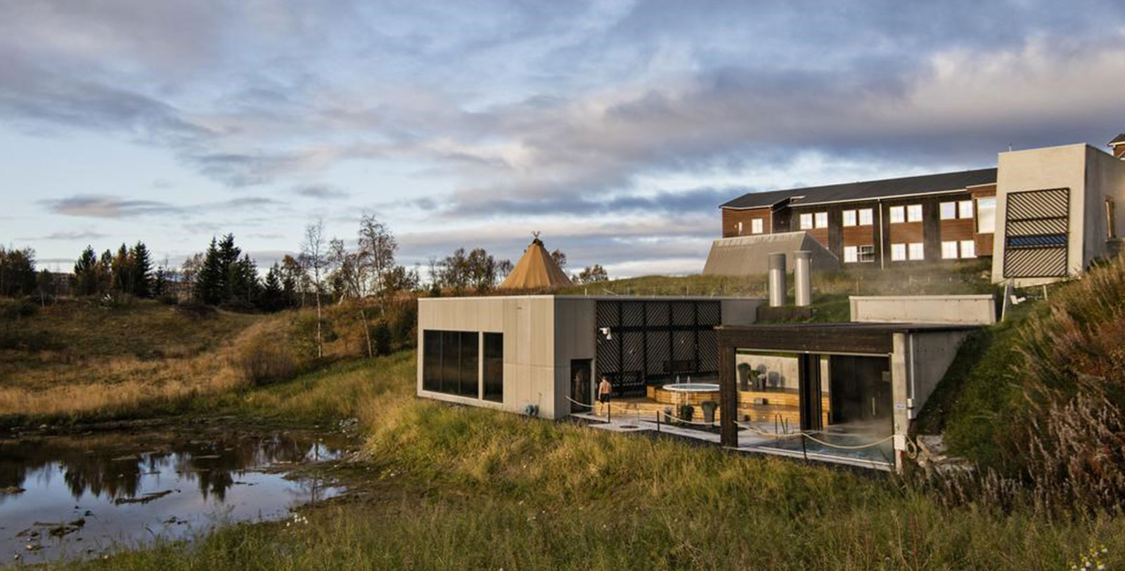 a building with a pool and a hot tub