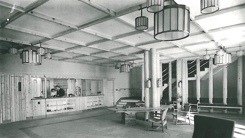 a man standing behind a counter in a room
