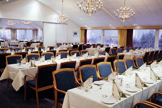 a room with tables and chairs