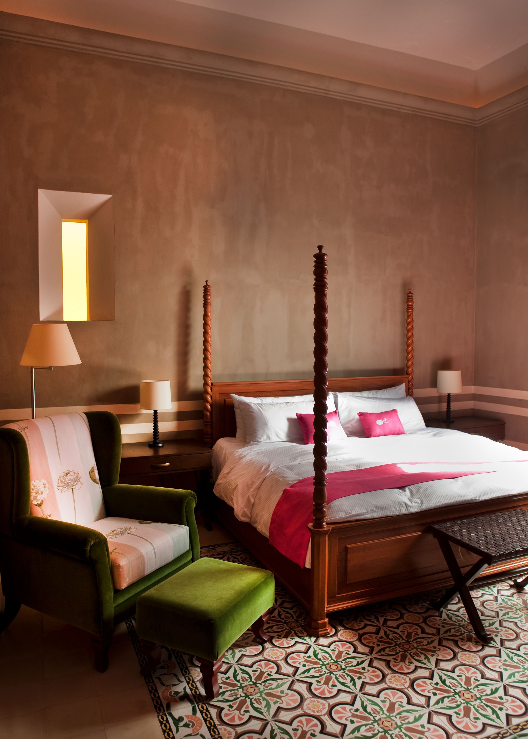 a bed with a chair and a table