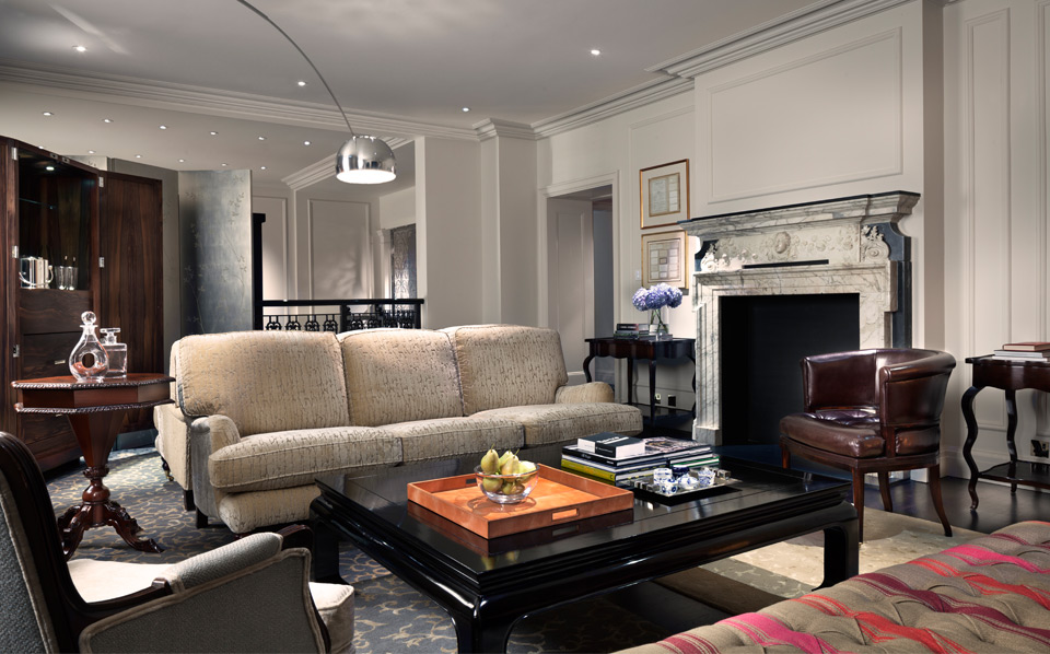 a living room with a fireplace and couches