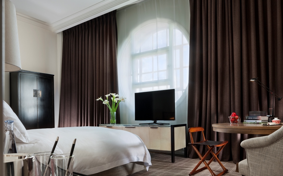 a room with a bed and a tv