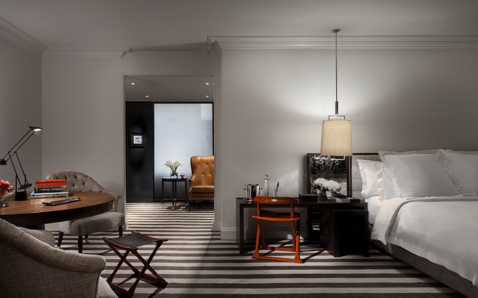 a room with a bed and a chair