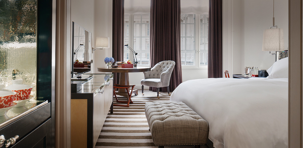 a bedroom with a bed and a table