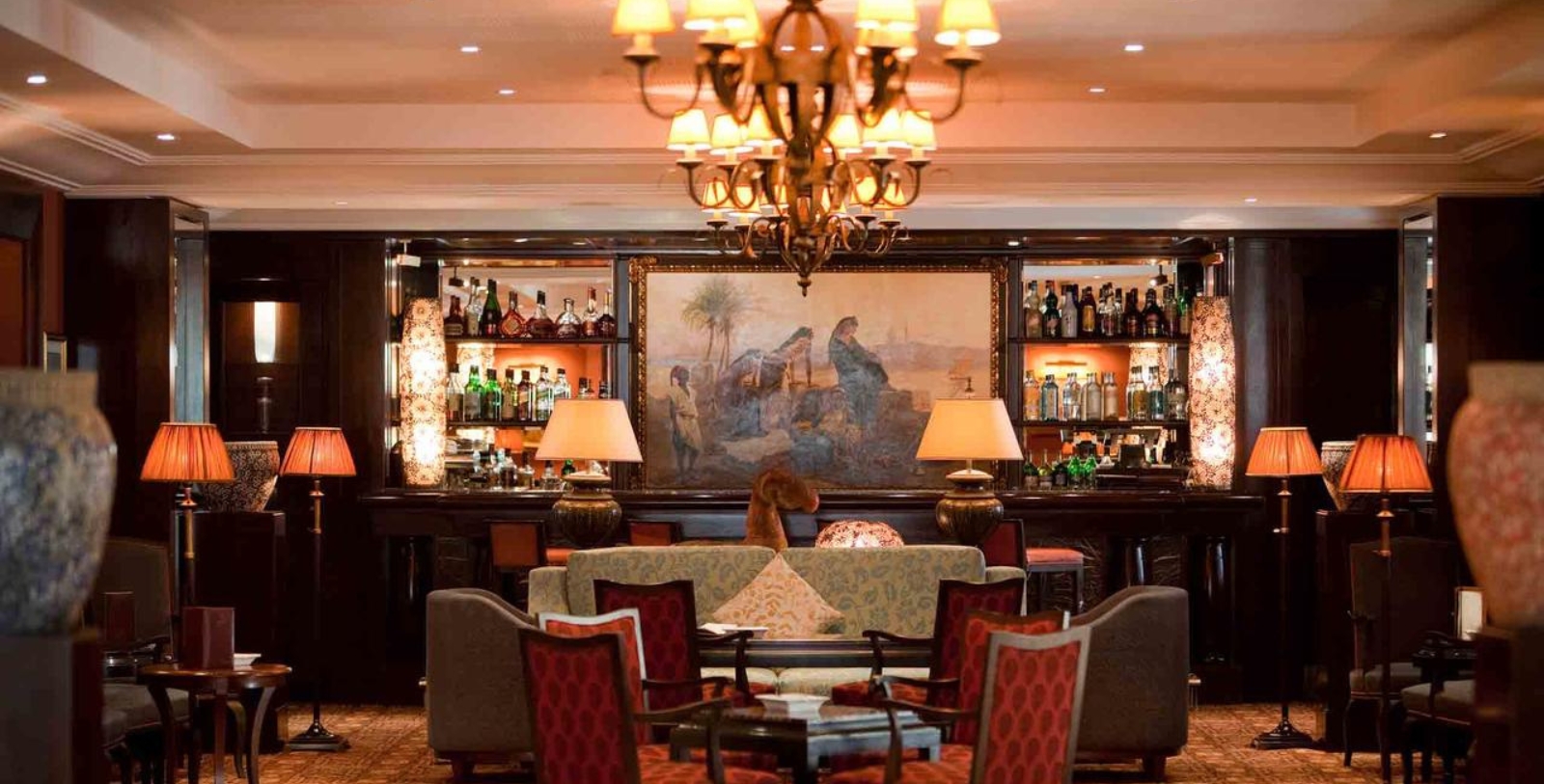 a bar with a painting on the wall