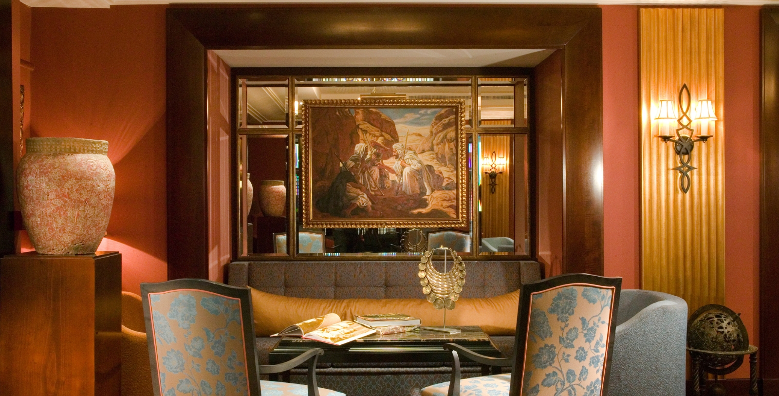 a room with a painting on the wall