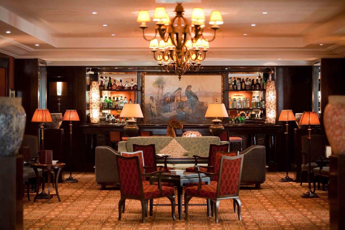 a room with a bar and a chandelier