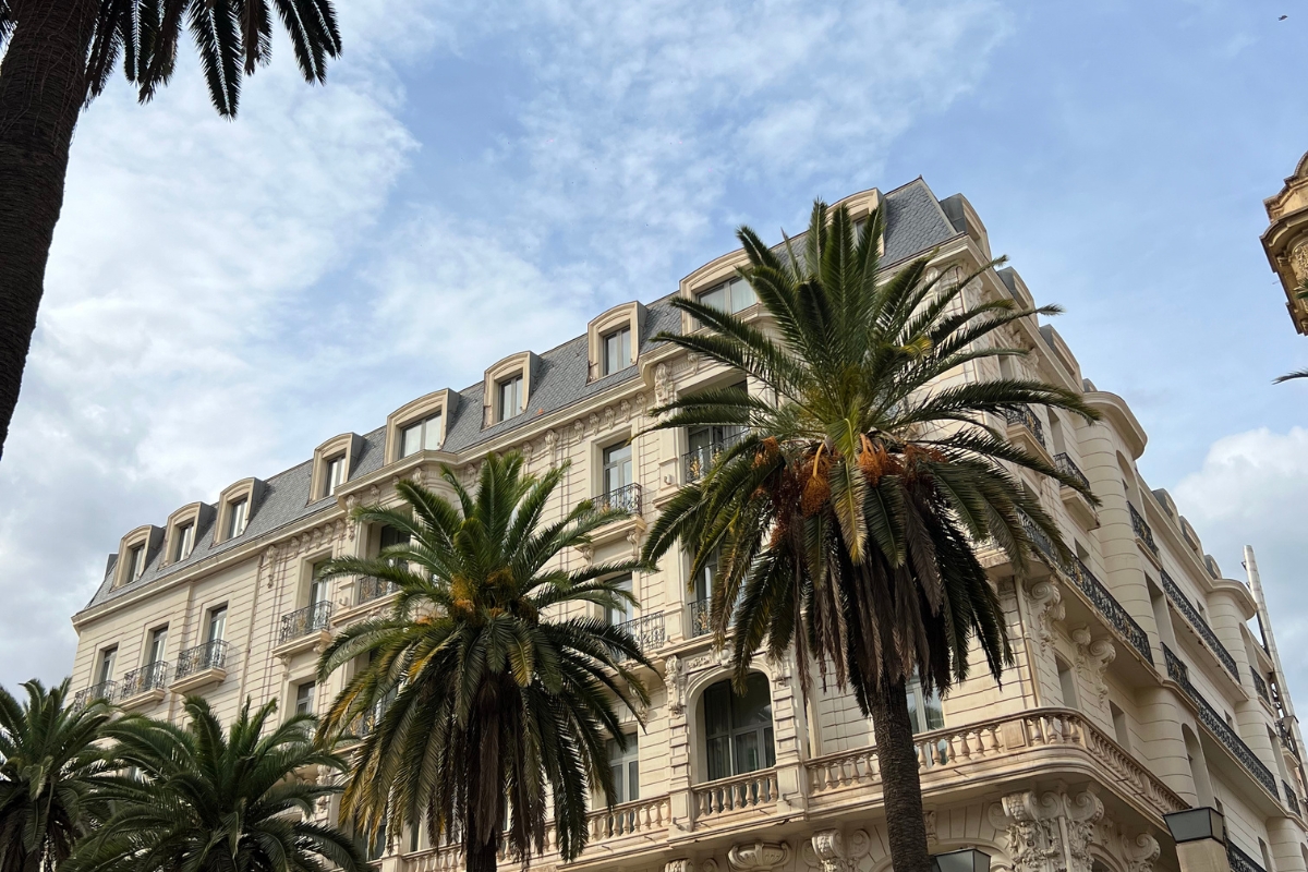 a building with palm trees