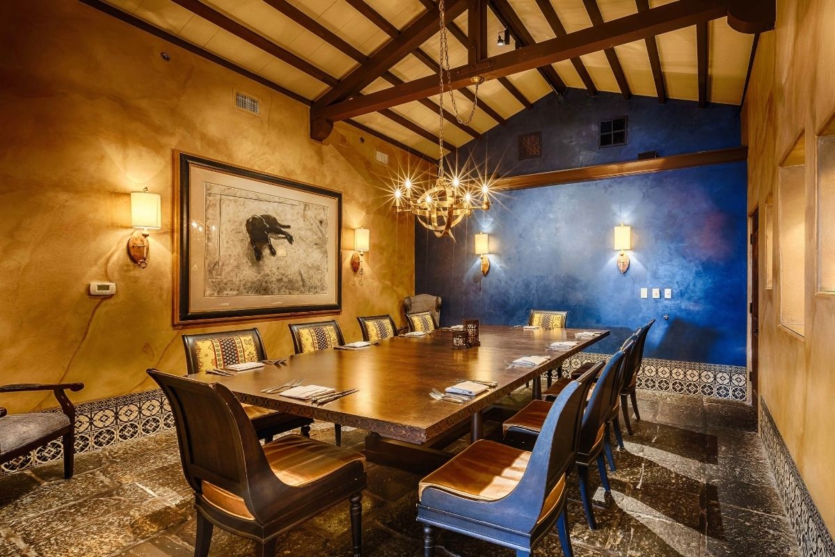 a room with a table and chairs