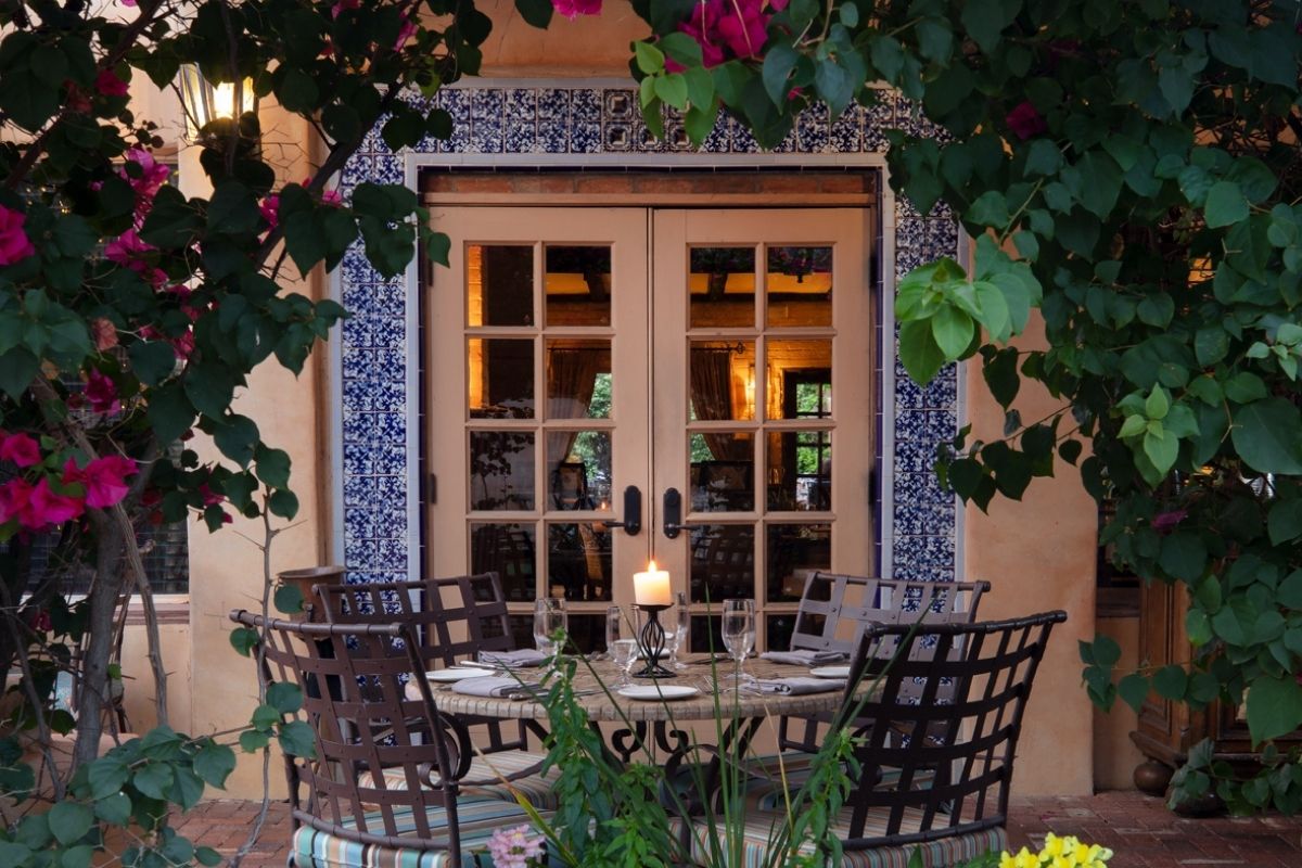 a table and chairs outside of a building