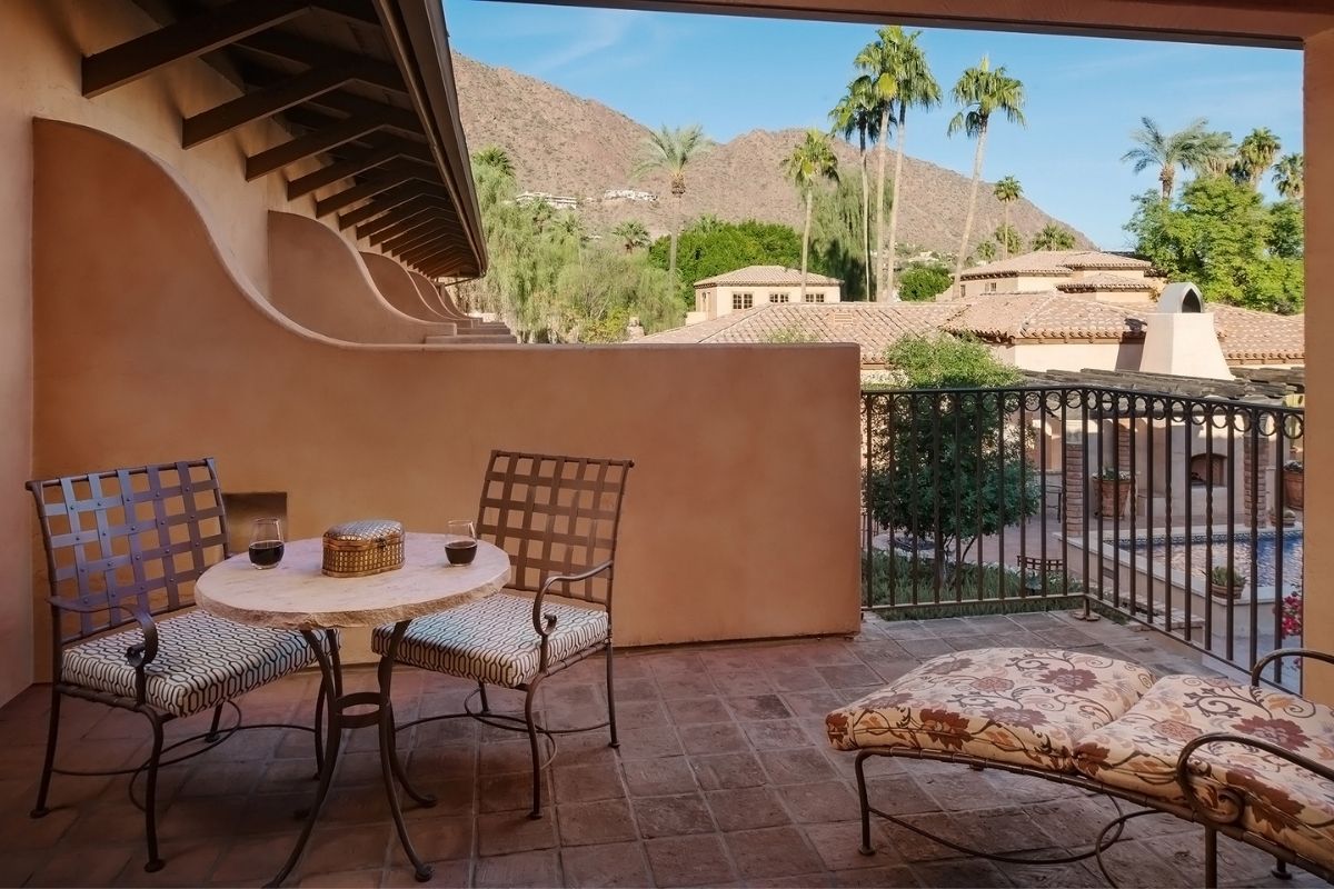 a patio with a table and chairs