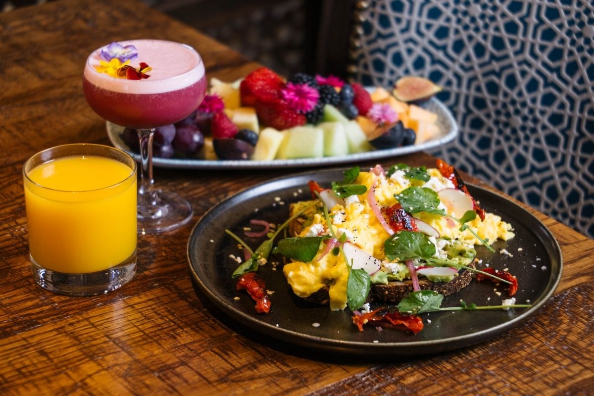 a plate of food and a drink on a table