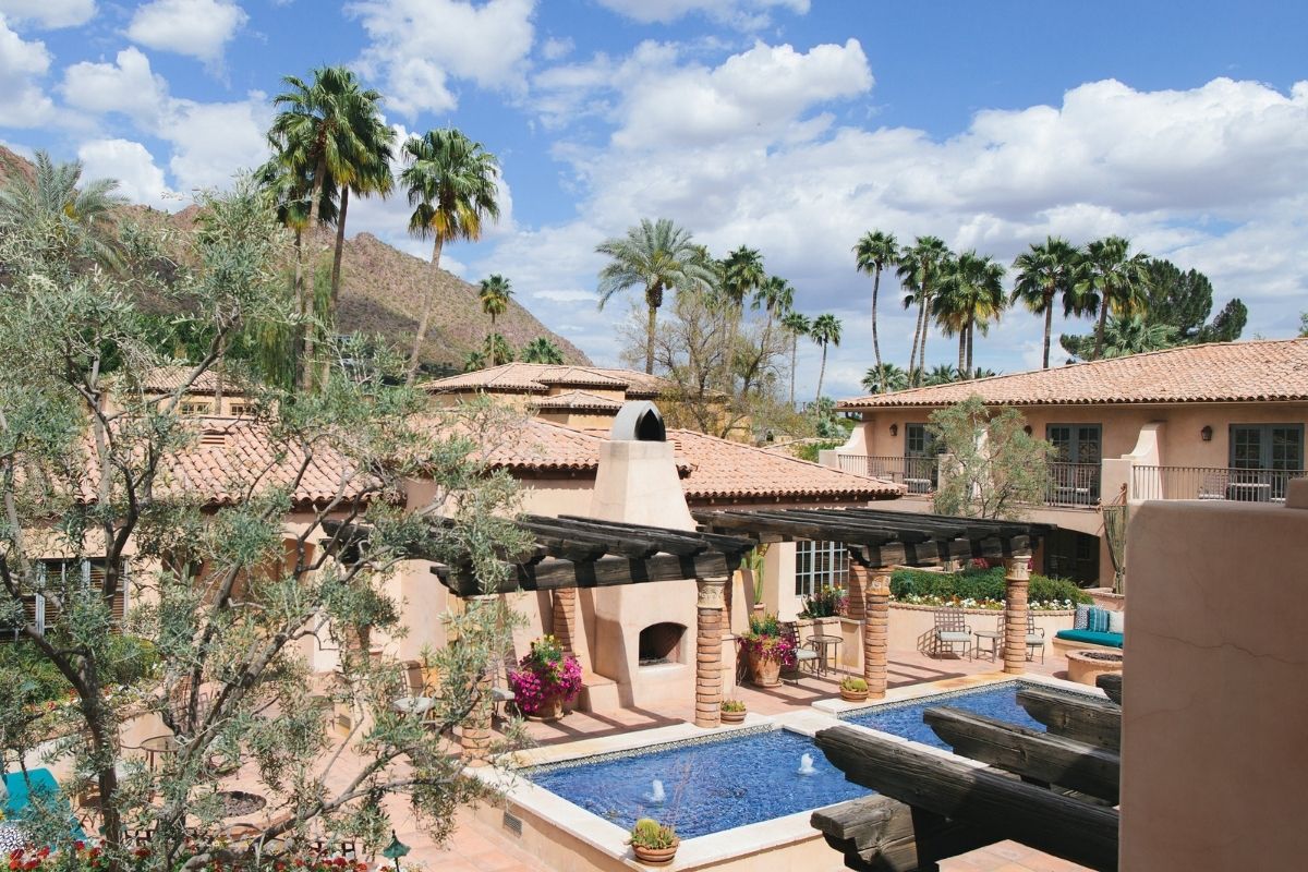 a pool in a courtyard of a house