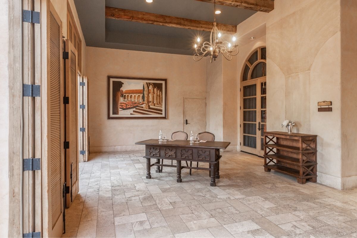a room with a table and chandelier