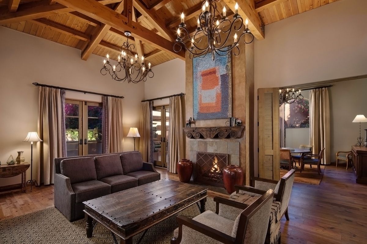 a living room with a fireplace and couches