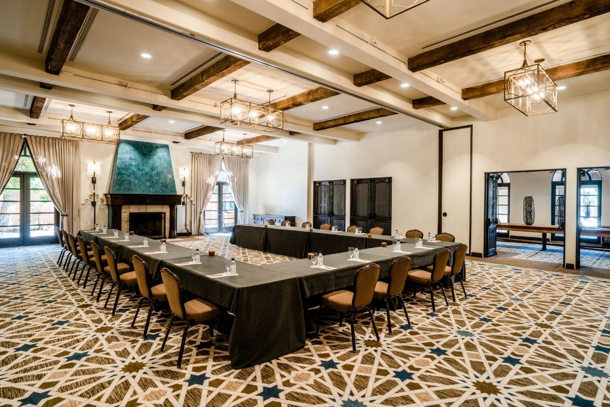 a large room with a long table and chairs