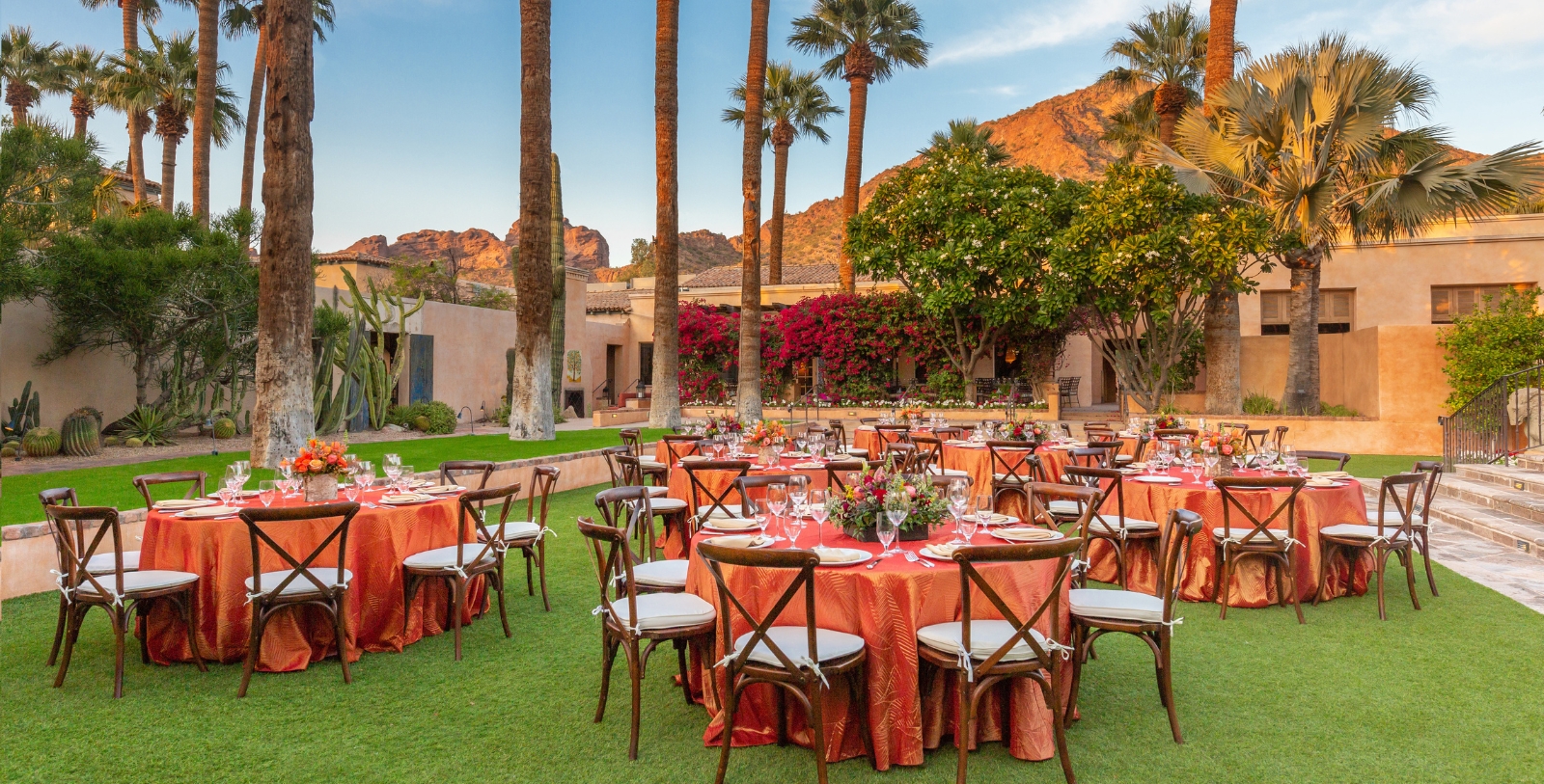 a group of tables set up in a courtyard