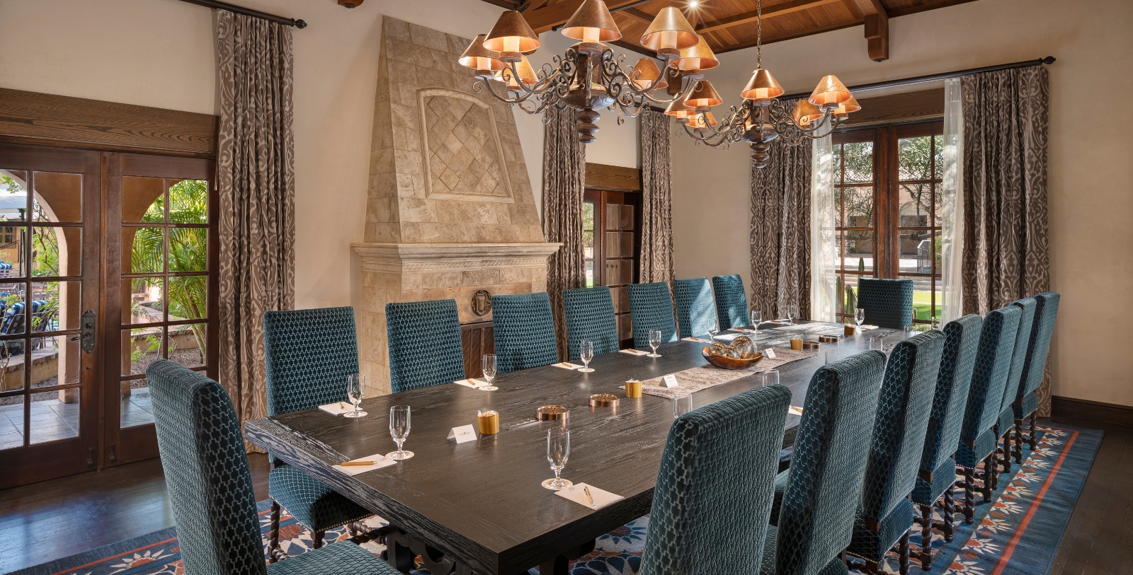 a large conference room with a chandelier and a large table