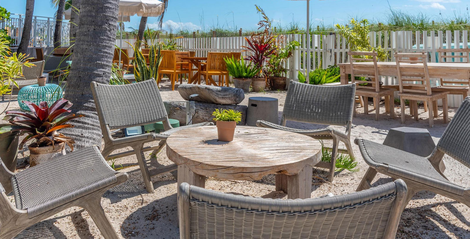 a patio area with chairs and tables