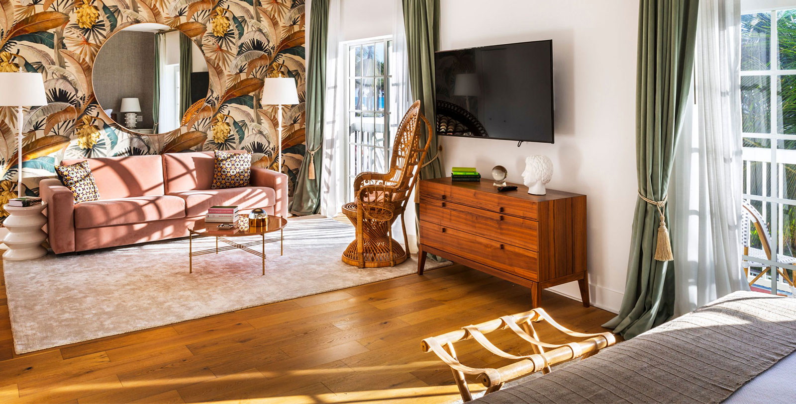 a living room with a television and a dresser