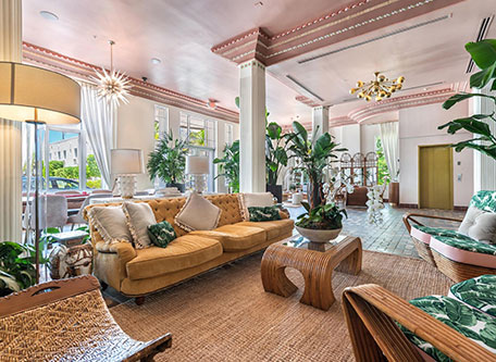 a room with a couch and chairs